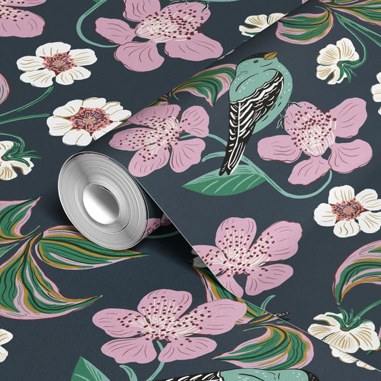 Dark floral pattern with pink blooms, white flowers, and colorful striped leaves on navy background